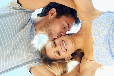 Buy stock photo Kiss, portrait or happy couple hug in outdoor on date for support or love in nature together. Low angle, romantic man or woman with joy or smile on holiday vacation for fun bond, travel or wellness