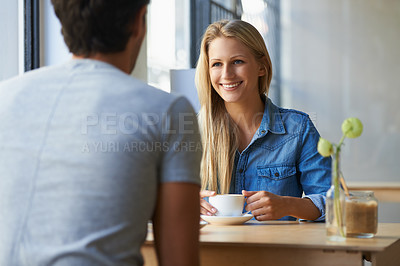 Buy stock photo Cropped shot of an affectionate young couple in a cafe