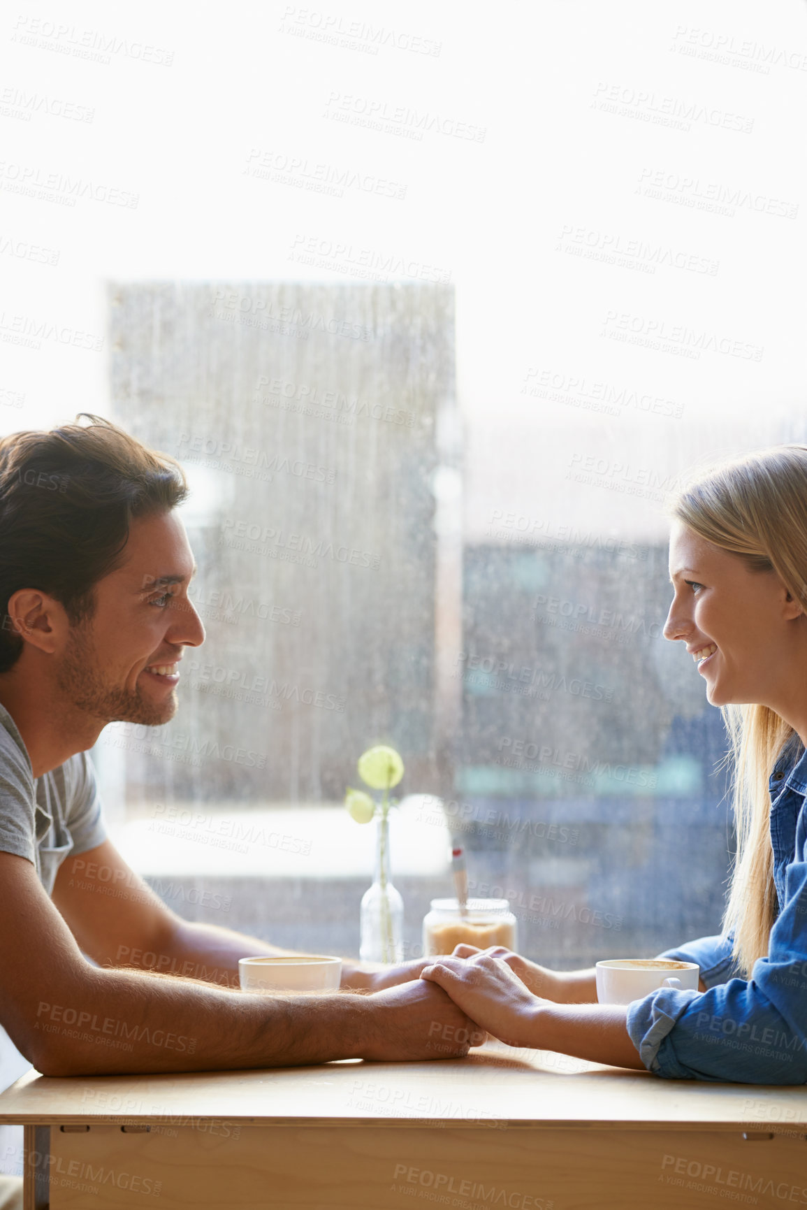 Buy stock photo Space, cafe or happy couple holding hands on date talking or speaking of anniversary or holiday vacation. Tea drink, woman or romantic man in conversation for care, love or support in coffee shop