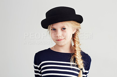 Buy stock photo Fashion, happy and portrait of child in a studio with casual, cool and stylish outfit and hat. Smile, youth and young girl kid with positive, good and confident attitude for style by white background