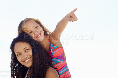 Buy stock photo Happy mother, child and pointing on piggyback at beach for exploring or sight on mockup space. Face of mom, daughter or kid smile for vision, adventure or looking in a distance on a sky background