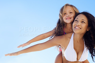 Buy stock photo Happy mother, little girl and piggyback in sun at beach for bonding, vacation or outdoor holiday together on mockup. Mom, child or daughter smile for love, support or summer on blue sky background