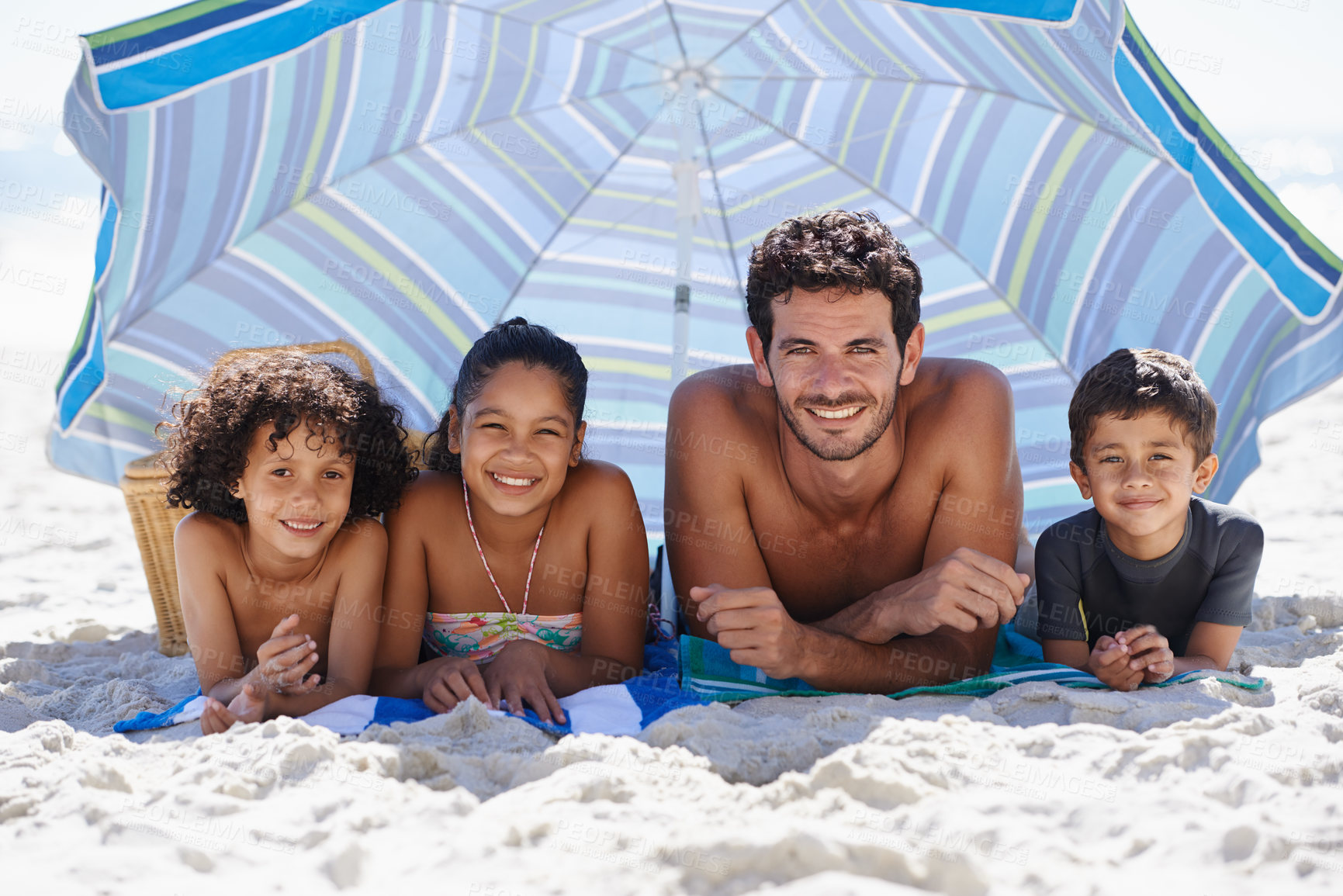 Buy stock photo Father, children and family on beach, happy in portrait for summer vacation with parasol, bonding and love. People outdoor for holiday in Brazil with sand and sun, travel and adventure together