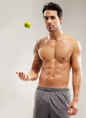 Buy stock photo Portrait, topless or man with apple, fitness or healthy diet for six pack abs in studio on gray background. Weight loss, throw or male person with a natural fruit for nutrition, vitamin c or wellness