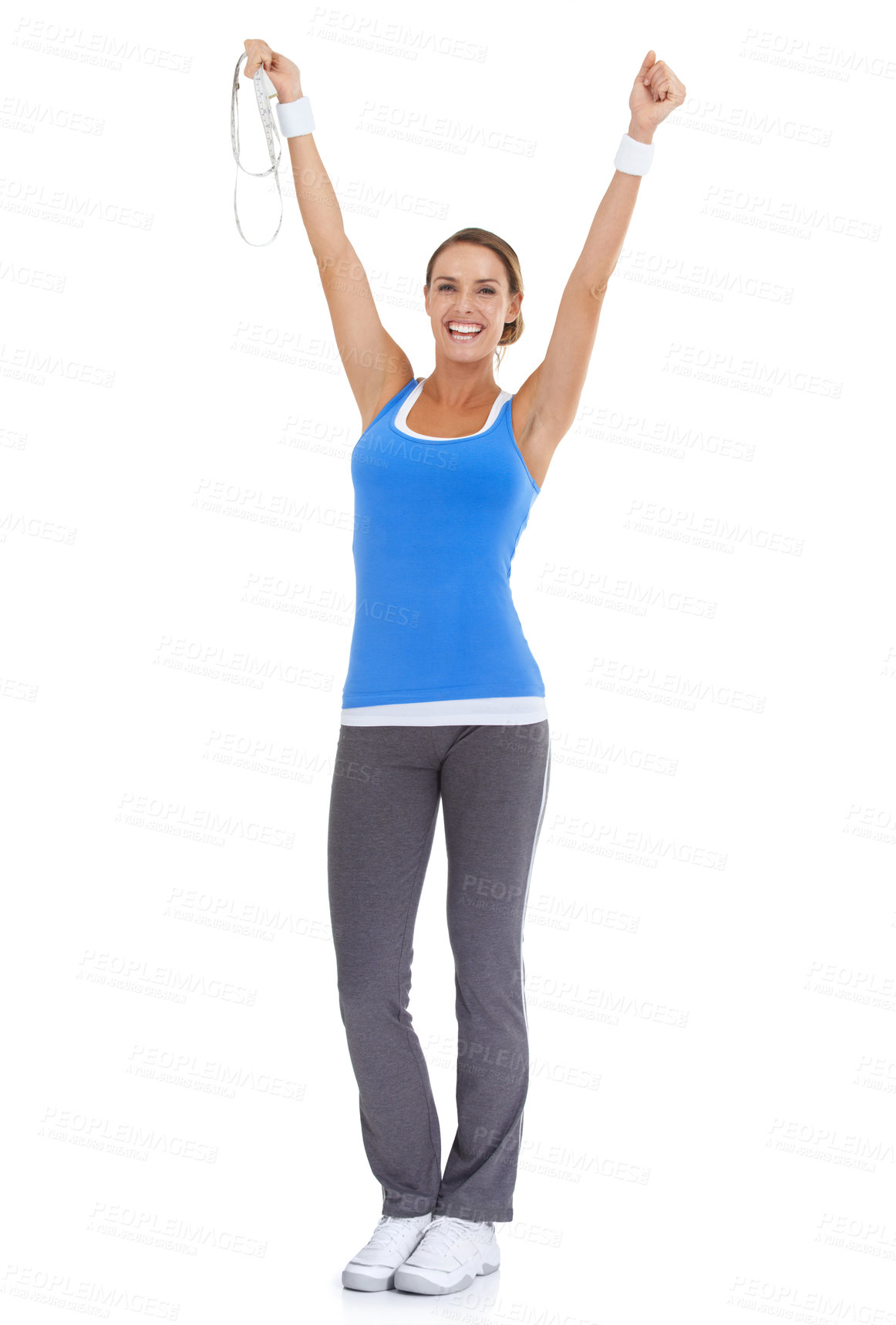 Buy stock photo Woman, workout success and celebration in studio with measure tape for exercise, fitness achievement or body goals. Model with fist and yes for results and training portrait on a white background