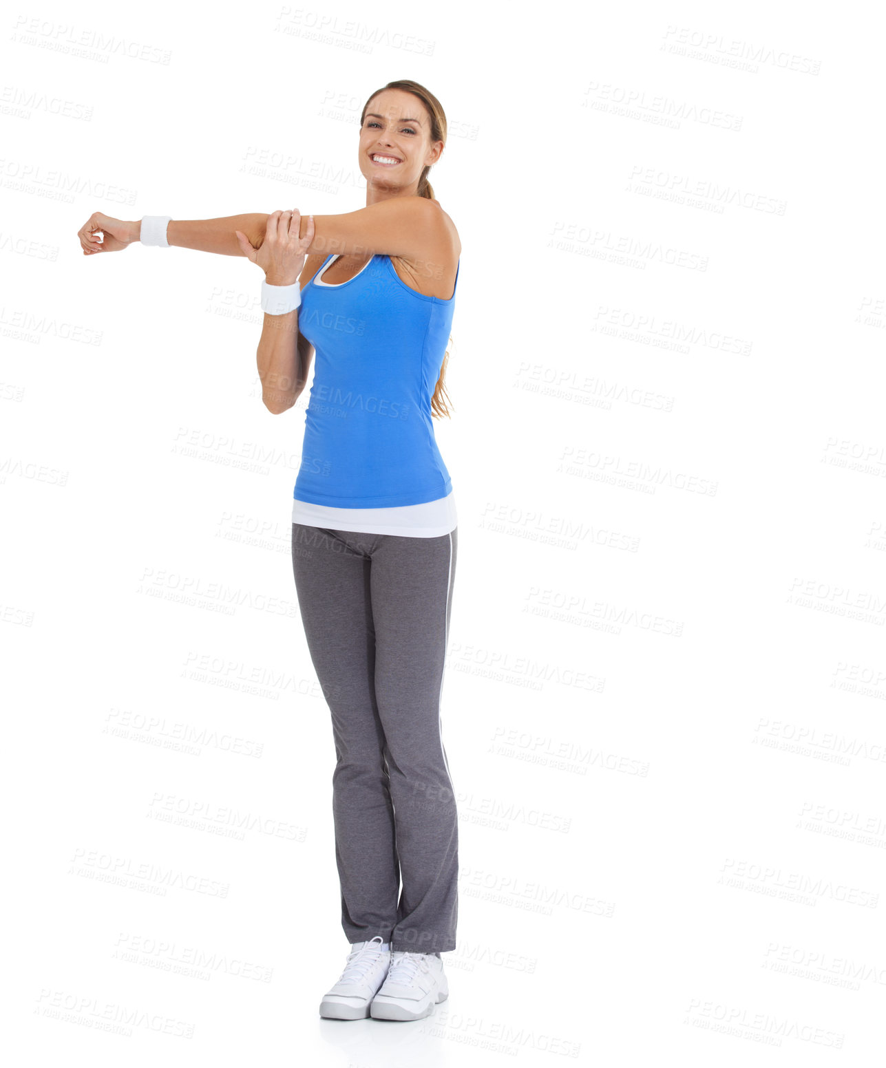 Buy stock photo Fitness, smile and portrait of woman stretching in studio for arm exercise, training or workout. Sports, health and young female person with muscle warm up for wellness activity by white background.