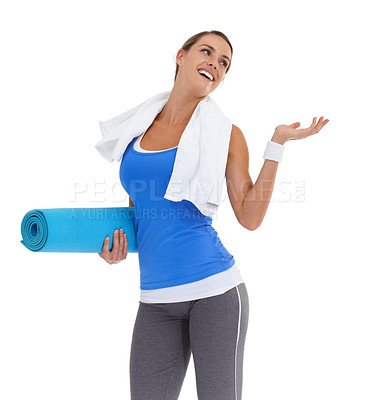 Buy stock photo Yoga mat, hand and young woman in studio with mockup space for exercise or workout. Smile, equipment and happy female person with show gesture for fitness or sports isolated by white background.