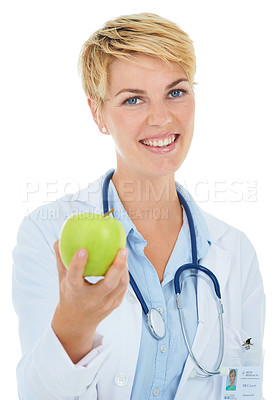 Buy stock photo A young smiling doctor holding a green apple