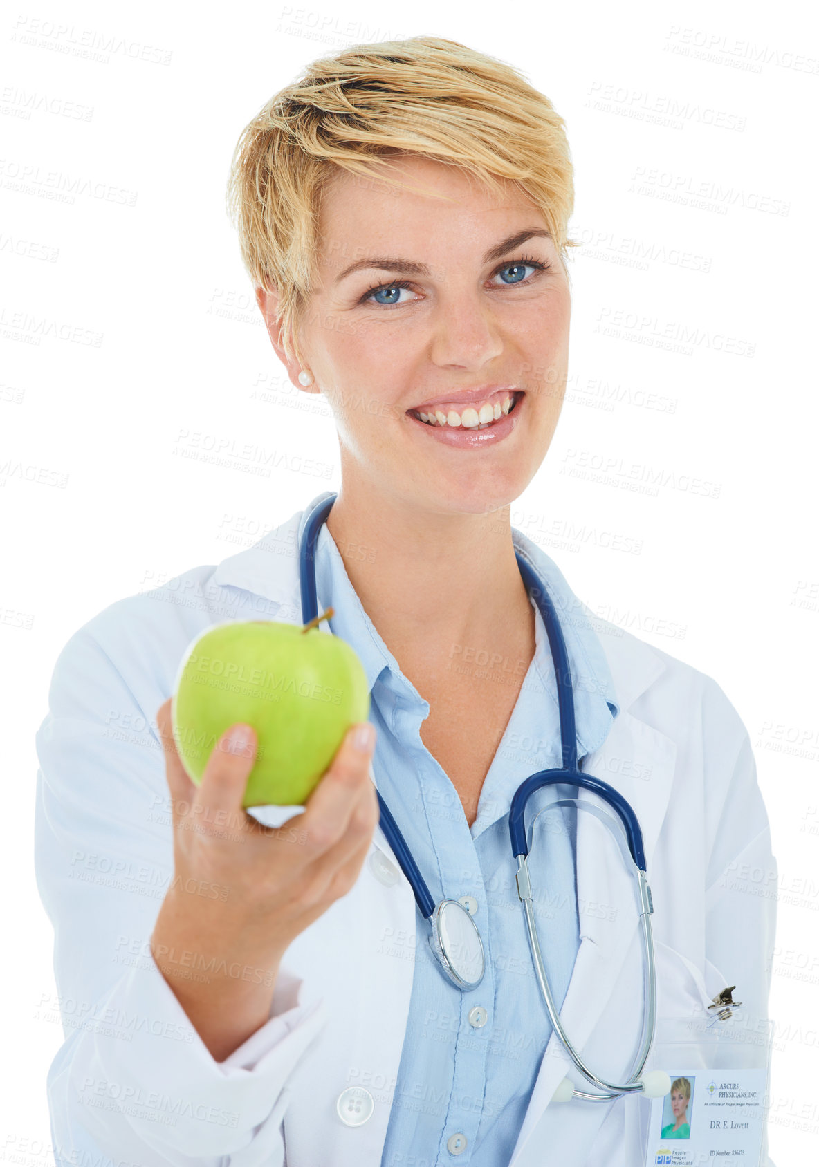 Buy stock photo A young smiling doctor holding a green apple
