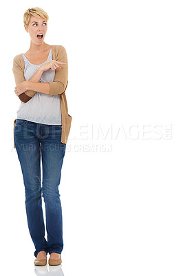 Buy stock photo Happy woman, surprise and pointing on mockup space for advertising on a white studio background. Female person or blonde in shock, fashion or casual clothing showing deal, marketing or special offer