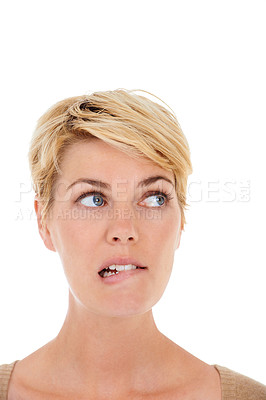 Buy stock photo Woman, face and thinking on mockup space for choice or decision on a white studio background. Closeup of female person, model or blonde biting lip in wonder or thought for selection, idea or doubt