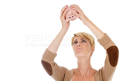 Buy stock photo Frustrated woman, piggy bank and financial crisis for debt, mistake or loss on white studio background. Young female person looking in empty money container for coins, cash or finance on mockup space