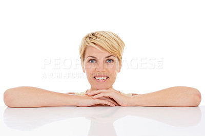 Buy stock photo Happy woman, portrait and relax with hands on table isolated on a white studio background. Face of young female person, model or blonde smile in confidence with hairstyle for beauty on mockup space