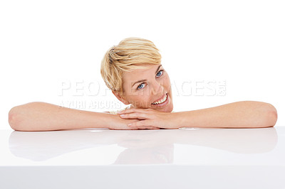 Buy stock photo Happy woman, portrait and relax on table with natural beauty isolated on a white studio background. Face of young female person, model or blonde smile on hands in confidence or style on mockup space