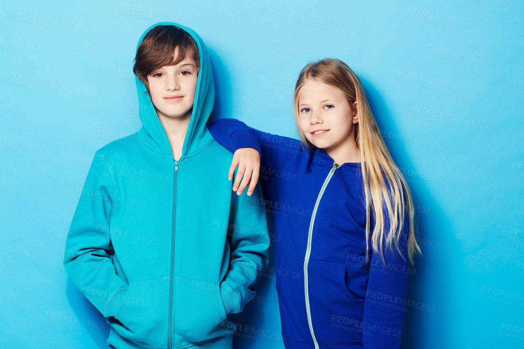 Buy stock photo Portrait of a young boy and a young girl in the studio