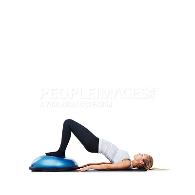 Buy stock photo Woman, lying and workout on bosu ball for exercise, training or abs on a white studio background. Active female person on half round object for pilates, practice or strong core on mockup space