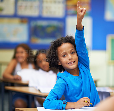 Buy stock photo A little boy raising her hand in class