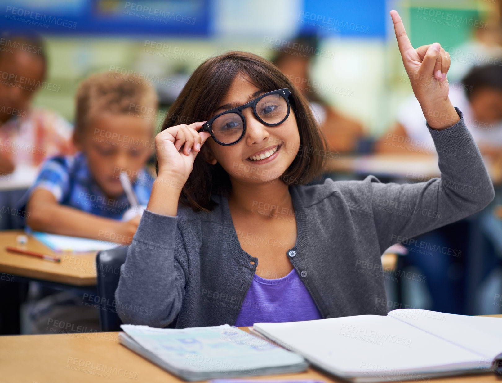 Buy stock photo Girl, portrait and raise hand in classroom, primary school and answer teacher question. Students, study and childhood development for education, knowledge and academic information for people
