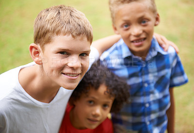 Buy stock photo Boy, friends and portrait or happy outdoor in summer with confidence, pride or diversity in nature. Children, face or smile on grass field with embrace for friendship, care and support on playground