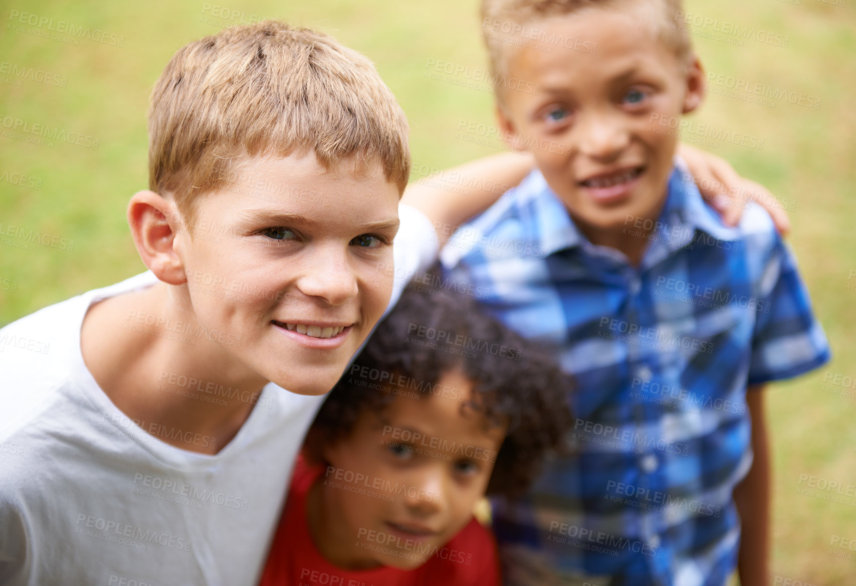 Buy stock photo Boy, friends and portrait or happy outdoor in summer with confidence, pride or diversity in nature. Children, face or smile on grass field with embrace for friendship, care and support on playground