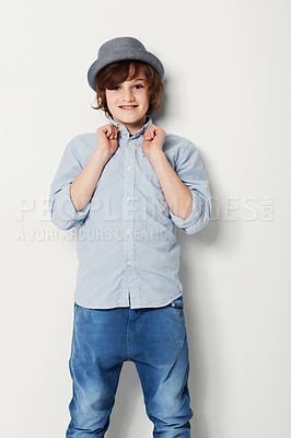 Buy stock photo Child, boy and portrait for fashion in studio, cool clothing and confidence by white background. Happy male person, kid and cute hat by backdrop or pride for style, face and trendy outfit or relaxing
