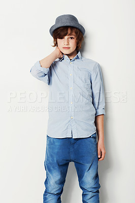 Buy stock photo Portrait, fashion and confident child in a shirt in studio isolated on a white background. Trendy style, cool kid and hat of young boy in jeans, casual clothes and serious on mockup space in Sweden