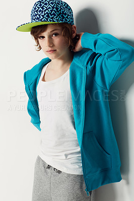 Buy stock photo Portrait, fashion and confident child in a hoodie in studio isolated on a white background. Trendy style, cool kid and cap of young boy in a hat, casual clothes and serious on a backdrop in Sweden