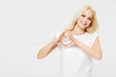 Buy stock photo Love, heart hands and portrait of woman with smile, kindness on white background. Motivation, support and loving heart sign finger gesture, happy woman model in studio with mockup product placement.