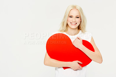 Buy stock photo Heart, shape and portrait of woman in studio for love, sign and care against white background. Face, emoji and girl holding an icon for peace, affection and self love with mockup space, happy and joy
