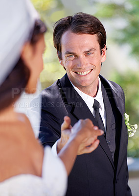 Buy stock photo Nature, happy woman and man holding hands at wedding with smile, love and commitment at outdoor reception. Romance, bride and groom at marriage celebration with garden, loyalty and future together.