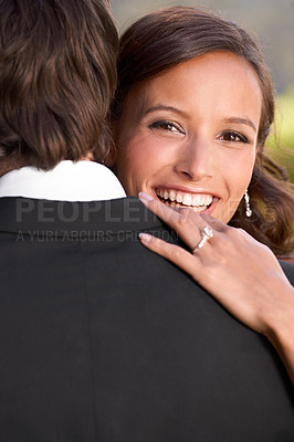 Buy stock photo Bride, portrait and embrace on wedding day for love, support and excited for marriage and commitment. Happy couple, romance and hugging at outdoor ceremony, loyalty and pride for ring and partnership