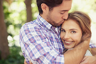 Buy stock photo Happy couple hug, bonding or forehead kiss on love date, valentines day or romance nature break, park or relax garden. Woman, smile or man kissing head in trust, security embrace or thank you support