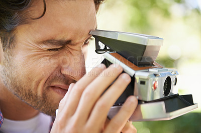 Buy stock photo Photography, shooting and man with a vintage camera in nature for a photo and hobby in France. Creative, artistic and zoom on a photographer taking pictures in a park for film and recreation