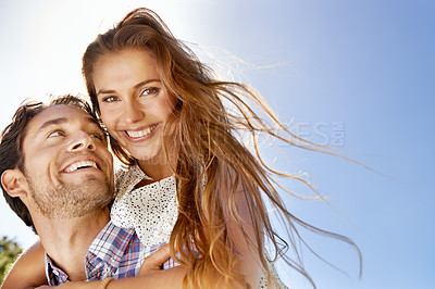 Buy stock photo Love, happy couple and piggyback on blue sky for summer, holiday or valentines date together in portrait. Young woman, excited partner or people face, hug and celebration in sunshine and mockup space