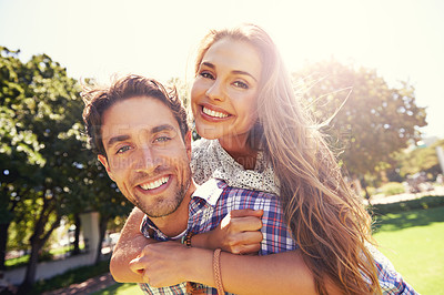 Buy stock photo Couple portrait, smile and piggyback on love, valentines day or romance date in park bonding, garden backyard or nature. Happy, man and carrying woman in fun game, freedom security or energy support