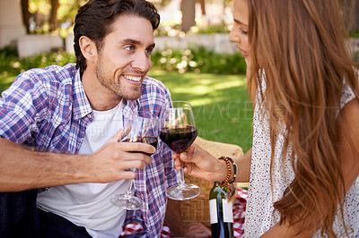 Buy stock photo Happy couple, love and wine toast for picnic, valentines day or romance date bonding in nature park or garden grass. Smile, woman and man and alcohol drinks glass in marriage anniversary celebration