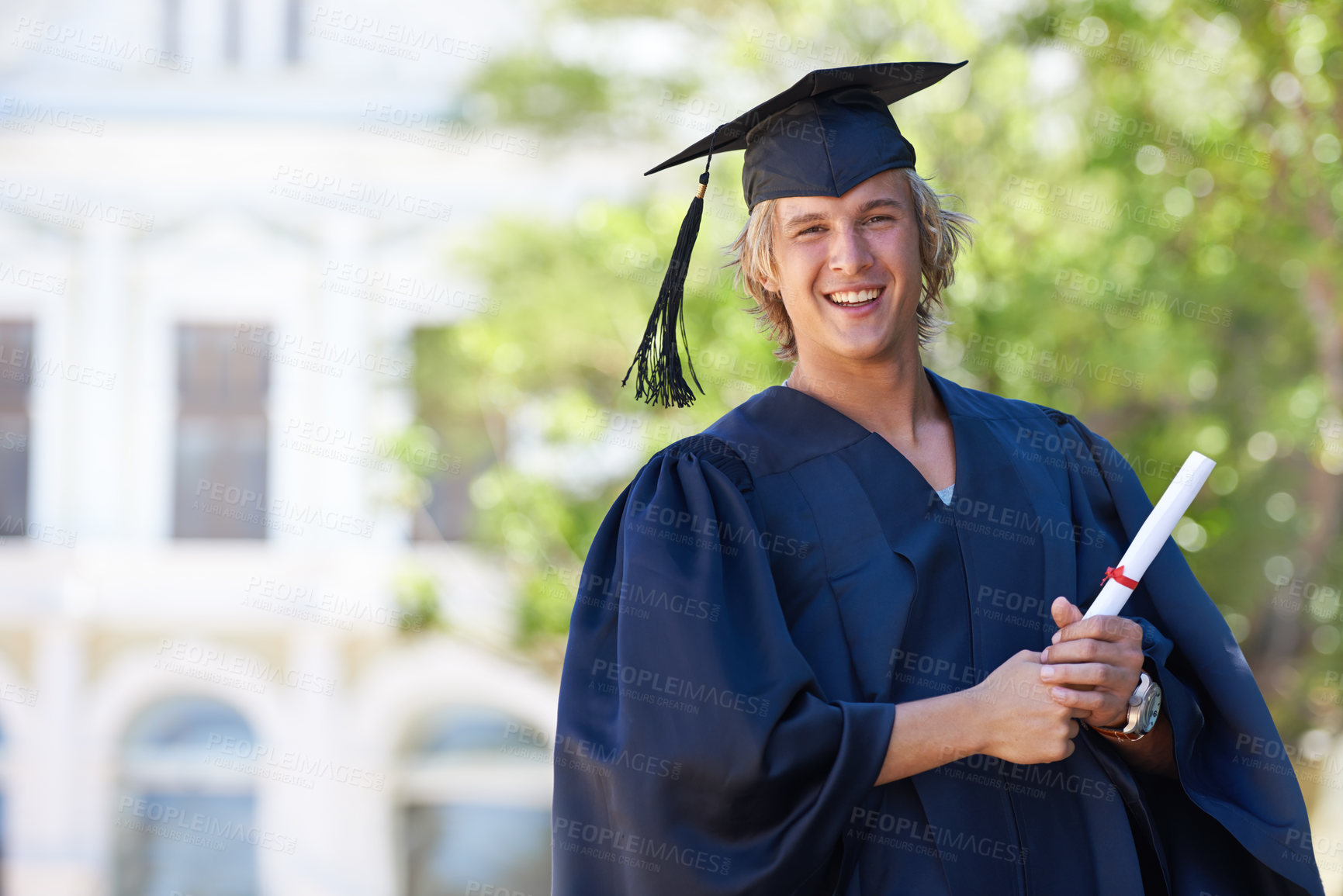 Buy stock photo Graduation, portrait and happy man on campus with certificate, smile and success with university education. School, scholarship and student with diploma for academic achievement with college degree.