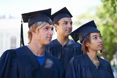 Buy stock photo Graduation, students and listening to education ceremony to celebrate college event outdoor. Group of university graduates in park for award, achievement and success of knowledge for future dream 
