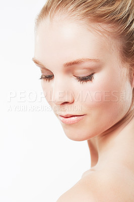 Buy stock photo Face of woman, shoulder or skincare for wellness with cosmetics, aesthetic or healthy glow. Facial dermatology, studio or confident model with pride or natural beauty results on white background 