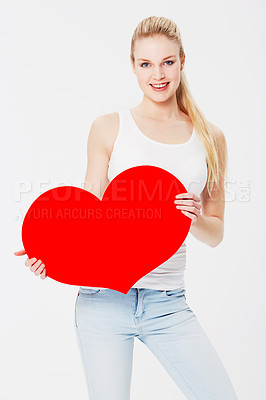 Buy stock photo Valentines day, portrait and woman with a heart in a studio with a smile for a romantic gesture. Happiness, excited and female model from Australia holding a love shape isolated by a white background