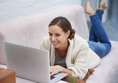 Buy stock photo Woman, laptop and happy on sofa with reading for relax, communication and typing in living room of home. Person, technology and smile for networking, streaming or research on internet or web on couch