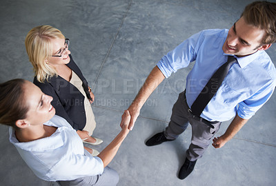 Buy stock photo Top view, handshake and happy business people in deal, thank you and partnership agreement. Teamwork, networking and shaking hands in collaboration, welcome and support of promotion, trust or success