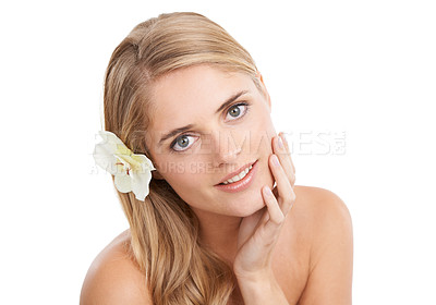 Buy stock photo Woman, portrait and beauty in studio with flower, makeup and smile for cosmetic glow on mock up. Model, person or sustainable dermatology for haircare or natural organic skincare on white background