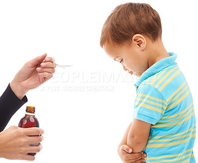 Buy stock photo Hands, medicine and spoon for child in studio, sad and thinking with arms crossed by white background. Kid, mother and bottle for healthcare, pharmaceutical product and helping sick boy in profile