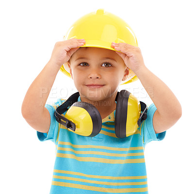 Buy stock photo Studio shot of a cute young boy pretending to be a construction worker