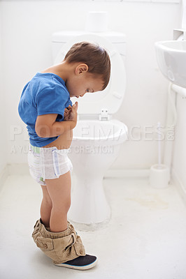 Buy stock photo Boy child, potty training and bathroom with thinking, diaper and pants on floor for learning, development and progress. Kid, family home and check in toilet with ideas, hygiene or solution with nappy