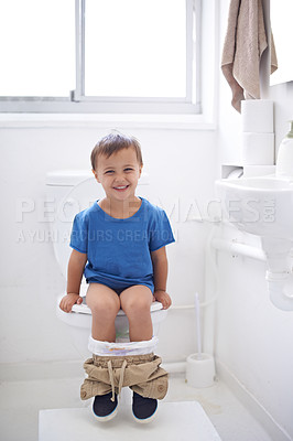 Buy stock photo Boy kid, potty training and toilet with sitting, diaper and happy in portrait for learning, development or progress. Child, family home and back in bathroom with smile, hygiene or solution with nappy