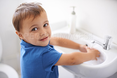 Buy stock photo Child, boy and washing hands in portrait, water and prevention of germs or bacteria in bathroom. Male person, kid and learning at basin or cleaning and sanitary, liquid and disinfection at home
