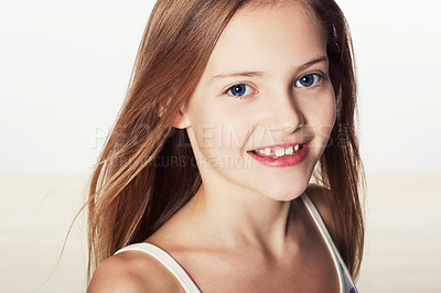 Buy stock photo Cropped portrait of a cute little girl smiling