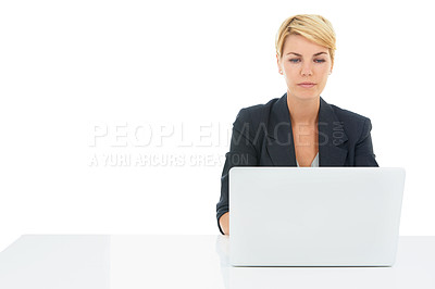 Buy stock photo Business woman, laptop and desk in studio for online research, planning and website for human resources. Professional worker reading on a computer, typing and job search or FAQ on a white background